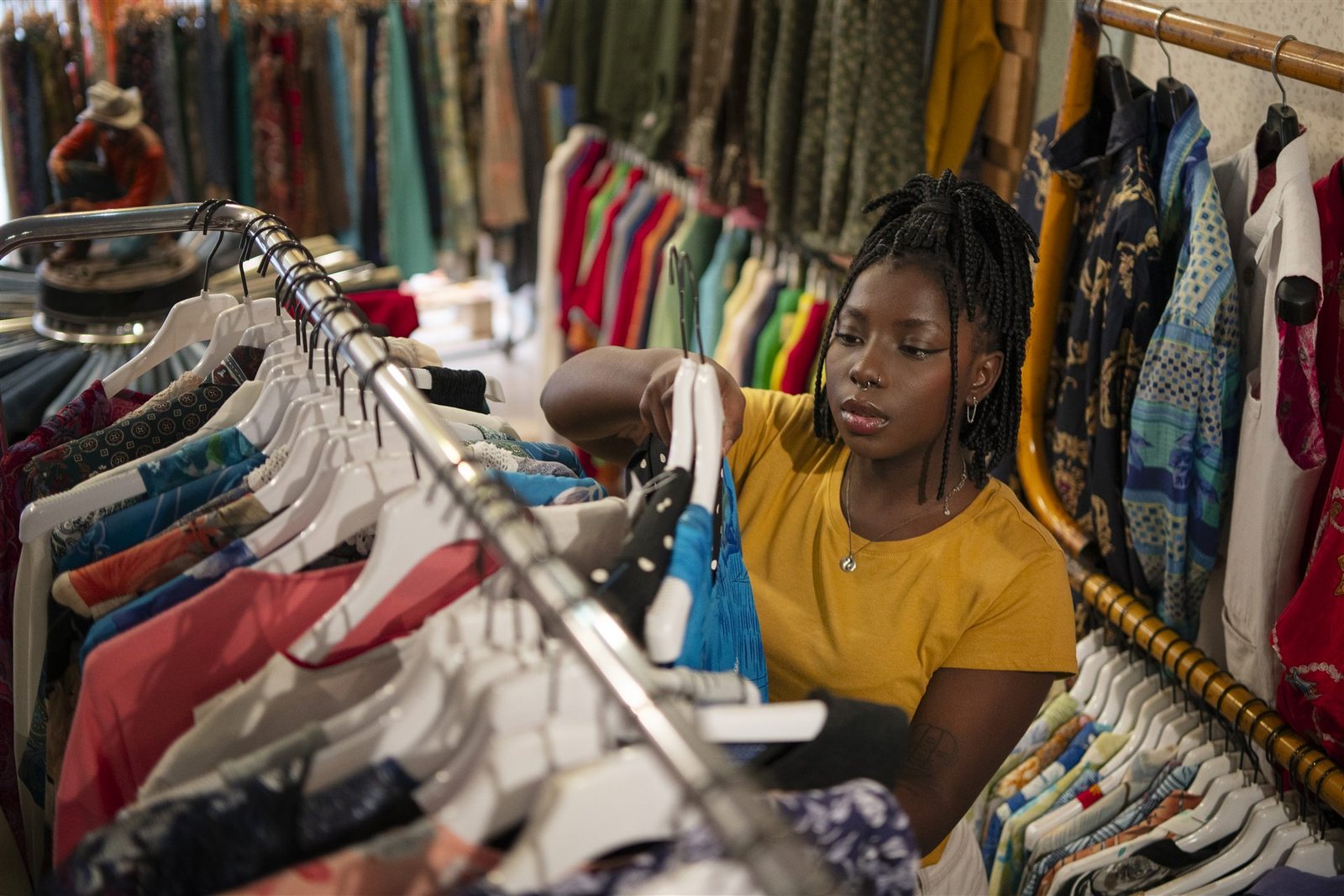Shop owner preparing items in her clothing store