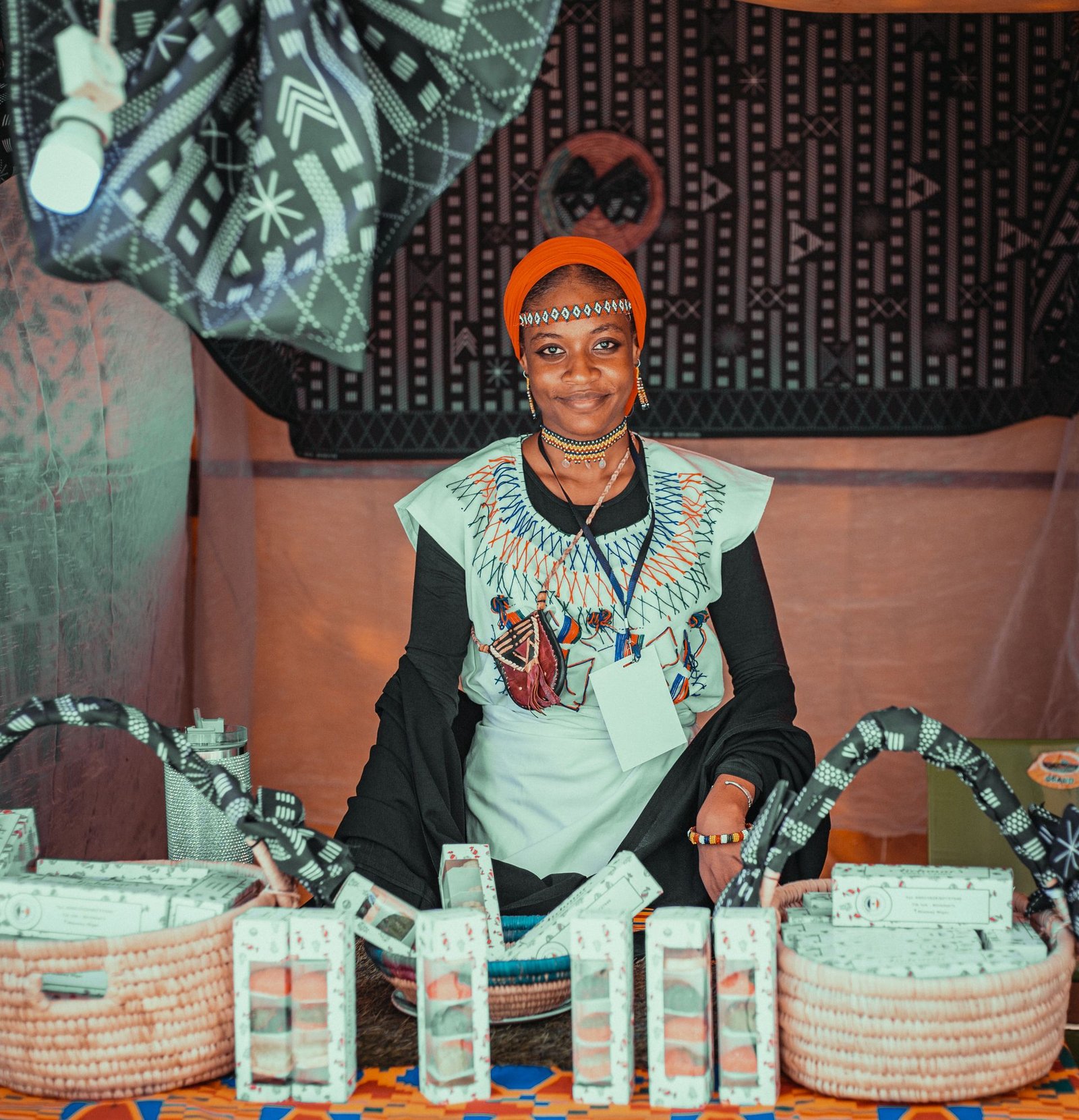 Smiling seller at her market stall